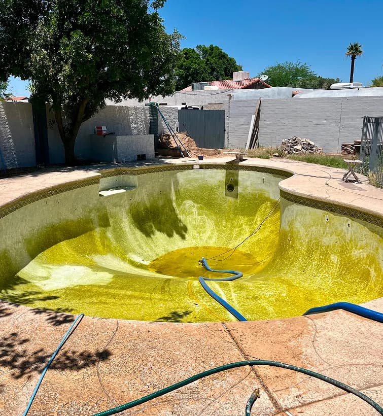 Drained pool with algae buildup ready for cleaning Glendale AZ