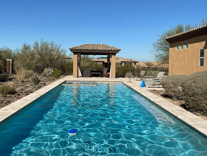 Clear lap pool with gazebo and desert landscaping North Phoenix
