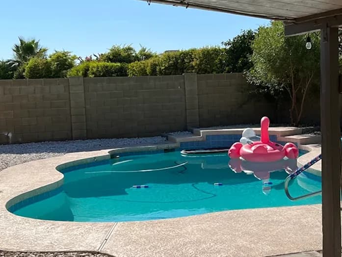 Clear North Phoenix pool with desert landscaping